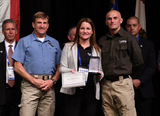 Kings Sheriff Sergeant Chris Barsteceanu, far right, earned certification as a SWAT operator. Left to right are CATO President Sid Hill, CATO Board Member Wendy Brown, and Barsteceanu.